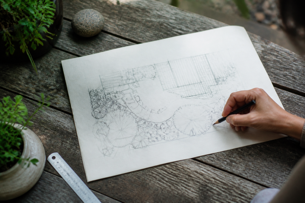 Croquis manuscrit de plan de jardin avec mesures et matériaux